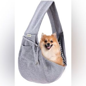 Small reversible sling pet carrier with safety strap with pocket